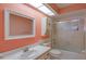 Bathroom features a white vanity, sink, and a shower at 8064 Brentwood Rd, Seminole, FL 33777