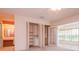 Spacious bedroom features large closet with folding doors and abundant shelving at 8064 Brentwood Rd, Seminole, FL 33777