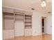 Spacious bedroom boasts built-in shelves and drawers with wood laminate flooring at 8064 Brentwood Rd, Seminole, FL 33777
