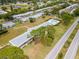 Aerial view featuring a community pool, landscaped grounds and residential buildings at 8064 Brentwood Rd, Seminole, FL 33777