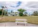 Exterior shot of community clubhouse featuring a lush lawn and an American flag at 8064 Brentwood Rd, Seminole, FL 33777