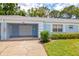 Charming single-story home with a one-car garage, blue paint, and well-maintained landscaping at 8064 Brentwood Rd, Seminole, FL 33777