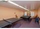Carpeted game room featuring ping pong table and pool table with chairs at 8064 Brentwood Rd, Seminole, FL 33777