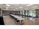 Large hall with rows of tables and chairs with view of exterior at 8064 Brentwood Rd, Seminole, FL 33777