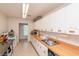 Bright kitchen featuring modern appliances, ample counter space, and white cabinetry at 8064 Brentwood Rd, Seminole, FL 33777