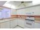 Well maintained kitchen with modern white appliances and great natural lighting at 8064 Brentwood Rd, Seminole, FL 33777