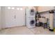 Inside laundry area features full size washer/dryer and utility sink at 8064 Brentwood Rd, Seminole, FL 33777