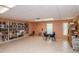 Community library with extensive bookshelf space, tables and seating, and natural light at 8064 Brentwood Rd, Seminole, FL 33777