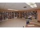 Large library space with ample bookshelves to provide reading material in a quiet area of the community at 8064 Brentwood Rd, Seminole, FL 33777