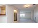 Living room featuring an open floor plan with a view of the kitchen and lots of natural light from windows at 8064 Brentwood Rd, Seminole, FL 33777