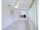 The living room features tile floors and a view into the office space and kitchen at 8064 Brentwood Rd, Seminole, FL 33777