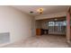 Bright living room with neutral carpet and ceiling light fixture providing comfortable space to enjoy time in at 8064 Brentwood Rd, Seminole, FL 33777