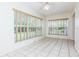 Inviting living room offers tiled floors and natural light through two sets of windows at 8064 Brentwood Rd, Seminole, FL 33777