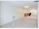 Spacious room featuring neutral carpet, a window with blinds, and offering ample living and work space at 8064 Brentwood Rd, Seminole, FL 33777