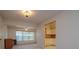 Open floor plan in living room leads to the kitchen providing easy access and flow for the home at 8064 Brentwood Rd, Seminole, FL 33777