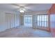 Primary bedroom with carpet, sunroom and ensuite bathroom at 8064 Brentwood Rd, Seminole, FL 33777