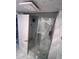 Modern bathroom with a frameless glass shower door and elegant tile throughout at 880 Mandalay Ave # S302, Clearwater Beach, FL 33767