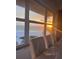 Bright dining area with sunset ocean views, complementing the modern table and chairs at 880 Mandalay Ave # S302, Clearwater Beach, FL 33767