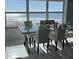 Dining area featuring ocean views through large windows, enhancing the modern table and chairs at 880 Mandalay Ave # S302, Clearwater Beach, FL 33767