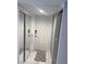 Clean hallway featuring neutral decor, recessed lighting, and ceramic tile flooring at 880 Mandalay Ave # S302, Clearwater Beach, FL 33767