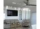Living area with modern furniture, TV, mirrors and open layout, designed for relaxation and entertainment at 880 Mandalay Ave # S302, Clearwater Beach, FL 33767