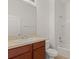 Traditional bathroom with a cherry-stained vanity and shower-tub combo at 8848 Moonlit Meadows Loop, Riverview, FL 33578