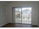 Bedroom with light walls, wood flooring, and a balcony at 8848 Moonlit Meadows Loop, Riverview, FL 33578