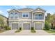 Well-maintained townhome with a private balcony and garages at 8848 Moonlit Meadows Loop, Riverview, FL 33578