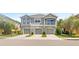 Townhome complex with well-maintained landscaping and garages at 8848 Moonlit Meadows Loop, Riverview, FL 33578
