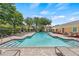 Large, inviting community pool with plenty of lounge chairs and shade at 8848 Moonlit Meadows Loop, Riverview, FL 33578