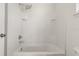Clean shower/tub combo with new fixtures and white tile surround at 8848 Moonlit Meadows Loop, Riverview, FL 33578