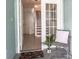Inviting entryway with stylish decor, a decorative chair, and a staircase leading upstairs at 623 Garland Cir, Indian Rocks Beach, FL 33785