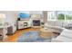 Cozy living room features a fireplace, comfortable seating, and a sliding glass door to a deck at 623 Garland Cir, Indian Rocks Beach, FL 33785