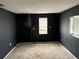 Spacious basement with dark colored walls and natural light at 10208 Oak Hill Dr, Port Richey, FL 34668