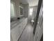 Bathroom featuring double sinks, neutral paint, and white cabinets at 10208 Oak Hill Dr, Port Richey, FL 34668