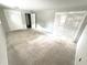 Large bedroom with neutral carpet, plantation shutters, and ample closet space at 10208 Oak Hill Dr, Port Richey, FL 34668
