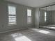 Bedroom with carpet floors, natural light, and mirrored closet doors at 10208 Oak Hill Dr, Port Richey, FL 34668