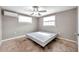 Cozy bedroom with two large windows providing plenty of natural light at 10381 108Th Ave, Largo, FL 33773