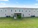 The backyard features a screened-in patio and lush green grass at 10436 Rivercrest Dr, Riverview, FL 33578