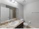 Bathroom featuring a vanity with marble countertop, a mirror, and a shower with a bathtub at 10436 Rivercrest Dr, Riverview, FL 33578
