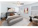 Well-lit bedroom with a plush bed, modern decor and ample natural light at 10436 Rivercrest Dr, Riverview, FL 33578