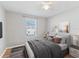 Bedroom with a comfortable bed, neutral decor and large window providing natural light at 10436 Rivercrest Dr, Riverview, FL 33578