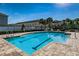 Outdoor community pool with clear water, marked lanes, and lounge chairs surrounding the pool deck at 10436 Rivercrest Dr, Riverview, FL 33578