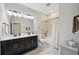 Modern bathroom featuring double sink vanity and bathtub with shower at 10736 Whitland Grove Dr, Riverview, FL 33578