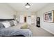 Serene bedroom featuring a plush, upholstered bed, soft lighting, and decorative accents for a peaceful sanctuary at 10736 Whitland Grove Dr, Riverview, FL 33578