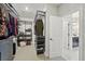Spacious walk-in closet with custom shelving and ample storage space at 10736 Whitland Grove Dr, Riverview, FL 33578