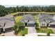 Beautiful single-Gathering home with a two-car garage and well-manicured landscaping facing a serene lake at 10736 Whitland Grove Dr, Riverview, FL 33578