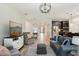 Bright living area with comfortable seating, stylish decor, and an open view of the kitchen at 10736 Whitland Grove Dr, Riverview, FL 33578