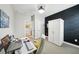 Office with black accent wall, modern furnishings, and ample natural light at 10736 Whitland Grove Dr, Riverview, FL 33578