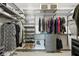 Spacious walk-in closet with custom shelving, hanging rods, and storage drawers to keep everything organized and accessible at 10736 Whitland Grove Dr, Riverview, FL 33578